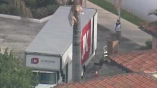 Moving trucks arrive at President Donald Trump's Mar-a-Lago club on Palm Beach