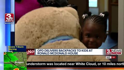 Omaha Police deliver backpacks to kids at Ronald McDonald House