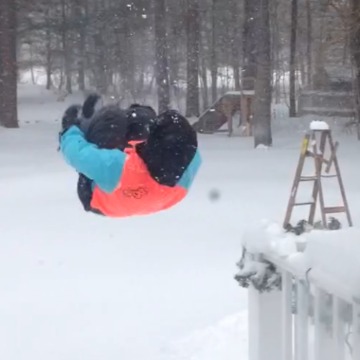 A Boy Flips Into Deep Snow
