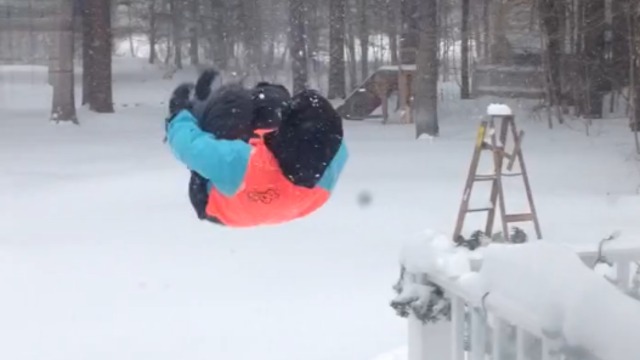 A Boy Flips Into Deep Snow