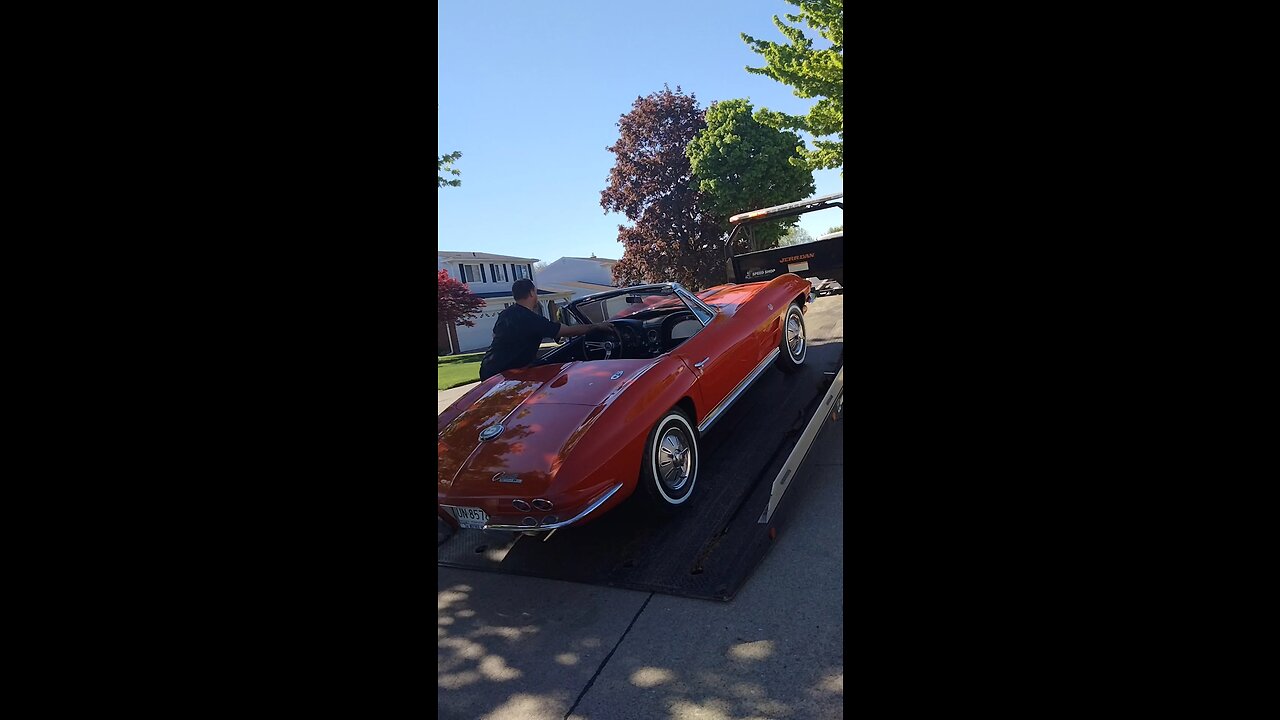 Loading classic Corvette letting customer film