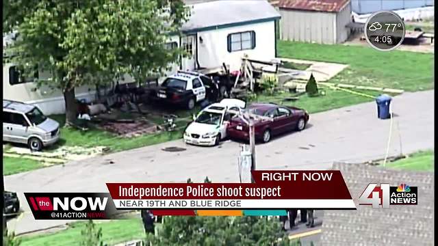 Officer shoots suspect; cop car hits nearby home