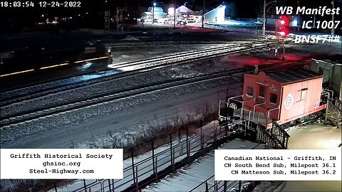 IC 1007 Leading WB Manifest with BNSF Fakebonnet as Mid DPU at Griffith, IN on December 24, 2022