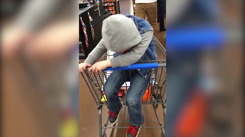 "Little Boy Falls Asleep in Shopping Cart"