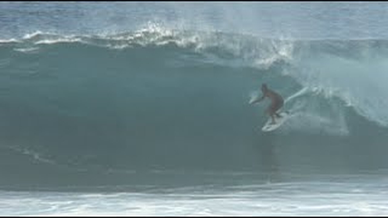 Pipeline: Locals, Pros, & World Champs enjoy a building North West swell at Backdoor. (12/12/02)