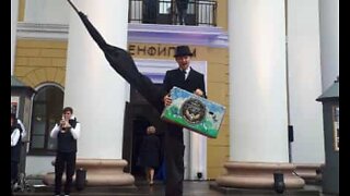 Stilt walker stumbles on red carpet