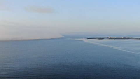 Drone captures fog rolling in at Galway Bay in Ireland