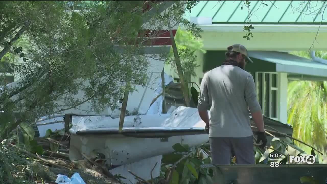 Crews work to remove plane crash debris