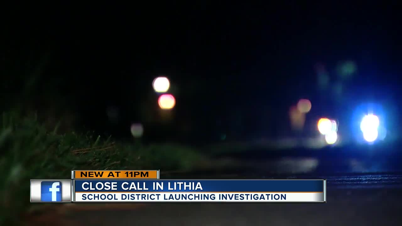 Driver says two girls nearly hit by car blowing past stopped school bus in Lithia