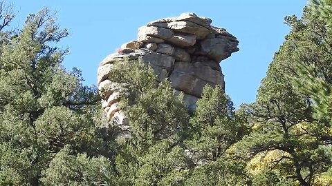 Small stacked rocks to the right of the rock head