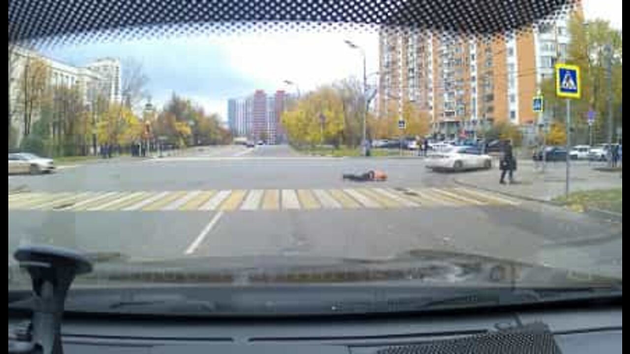 Man dragged along a Moscow street by speeding car