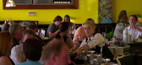 Certain restaurant workers wearing vaccinated wristbands for customers