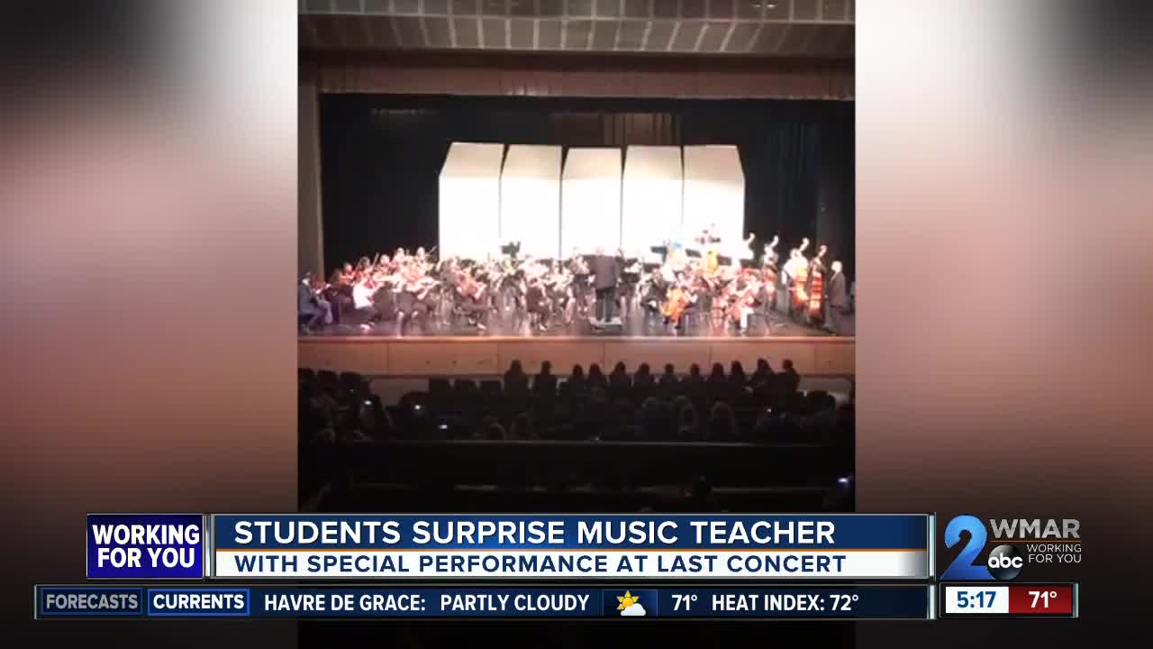 Students surprise music teacher with special performance at final concert