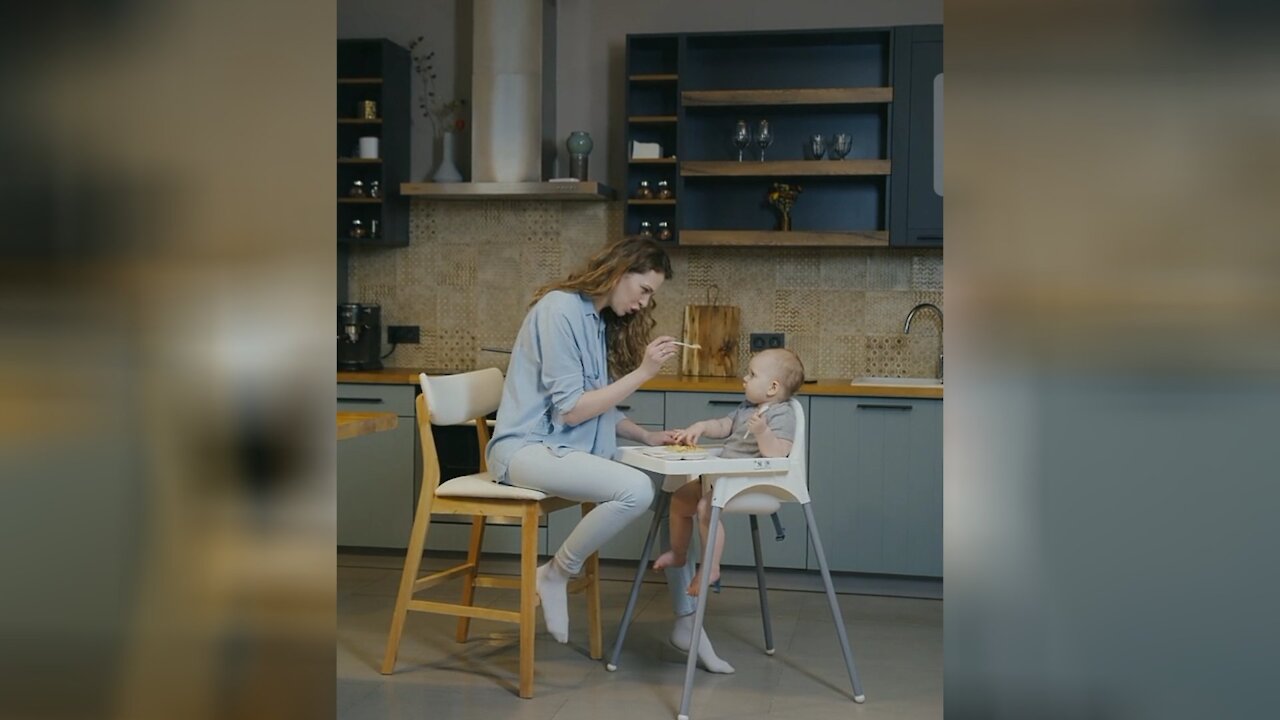 Cute baby enjoying his lunch.