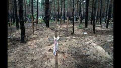 Ukrainian president says some mass burial victims were tortured