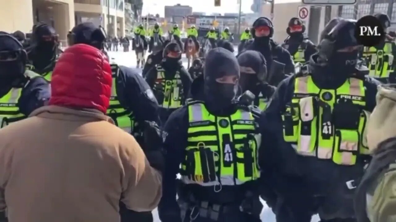 🇨🇦 POLICE BASH PROTESTOR WITH GUN. Slowed down so you can clearly see. WHAT THE FREAK, TRUDEAU?