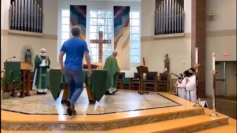 Satanic priest in Christian church pulling violence