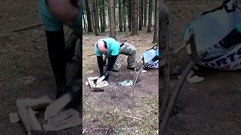 Woodland wildcamping clearing up the firepit and leaving the woodland.Leave No Trace