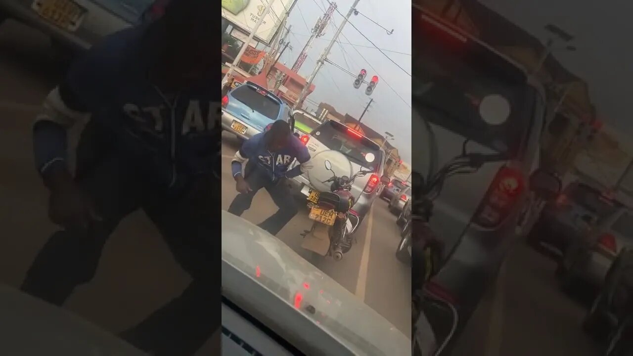 Boda Boda Rider dancing in the middle of the road at red traffic lights on Kampala streets #shorts