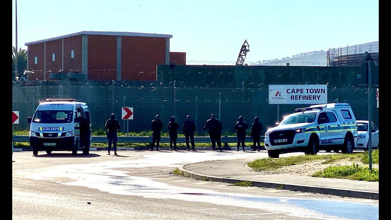 Police keep watch and fired teargas outside the Killarney entrance