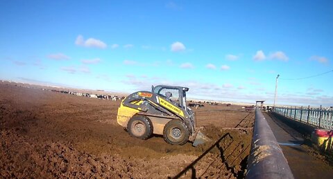 Pushing Feed, Cleaning Feed, and Scraping Heifer Pens