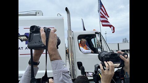 Trump adorned garbage truck tailing his motorcade.