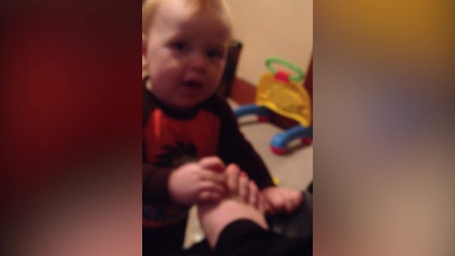 A Tot Boy Like To Chew On His Mom's Toes