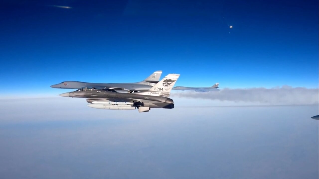 F-16 Fighting Falcon escorting B-1 Lancer