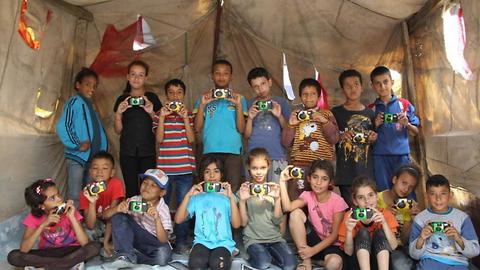 Organization Donates 500 Cameras To Refugee Children To Encourage Creativity