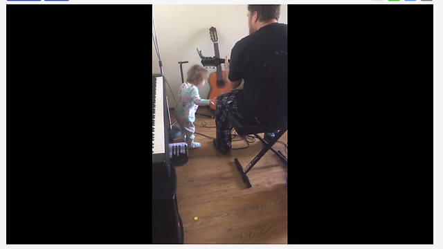 Baby girl rocks out to dad's guitar performance