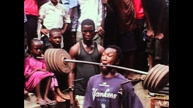 Man Weightlifts With Teeth