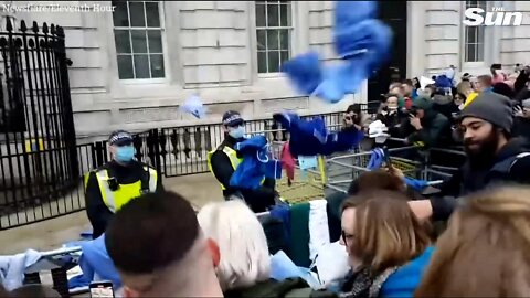 LONDON - NURSES THROW UNIFORMS AT DOWNING STREET