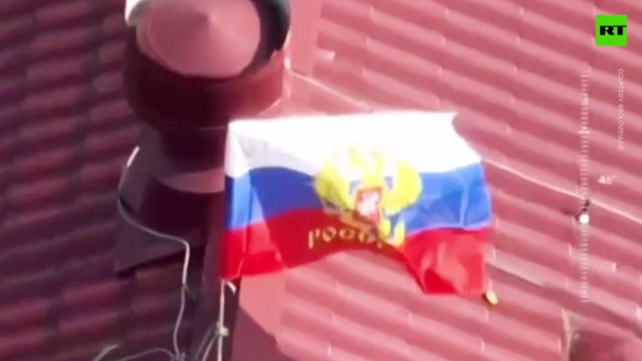 Russian Troops Raise Flag Over New York DPR