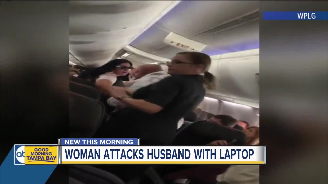 American Airlines passenger smashes laptop on man's back