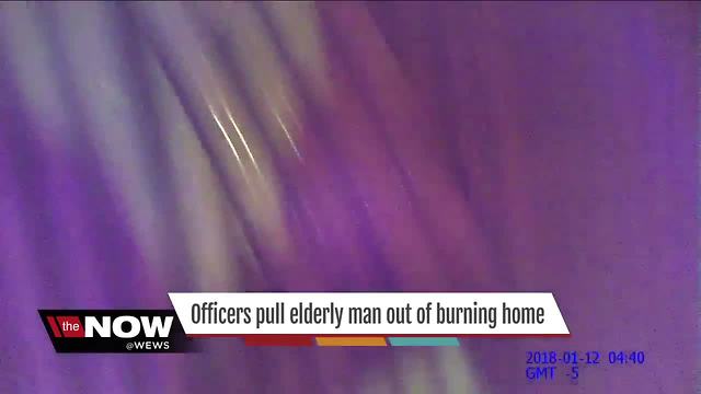 Officers pull elderly man out of burning home