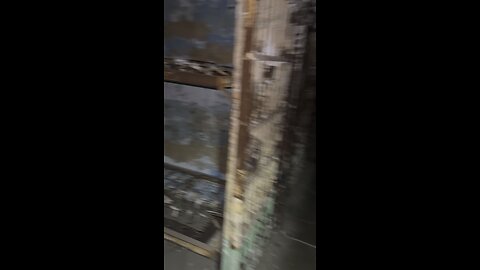 Pitch black walking down jail cell tier