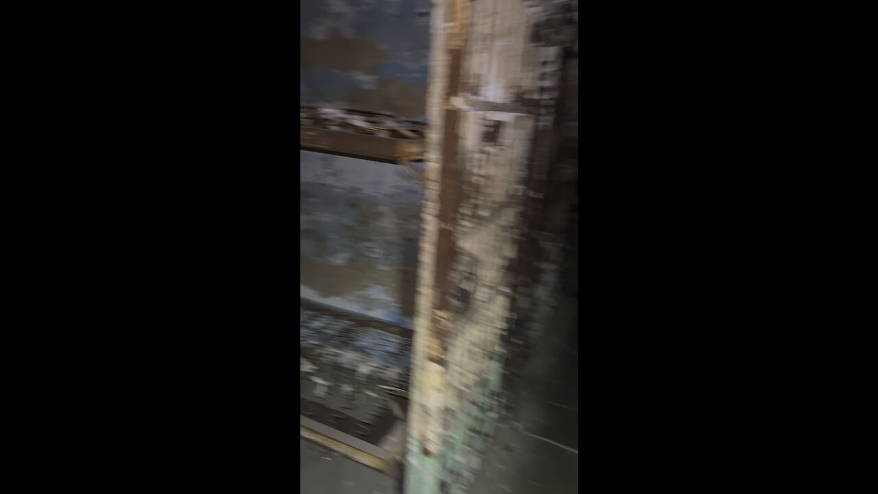 Pitch black walking down jail cell tier