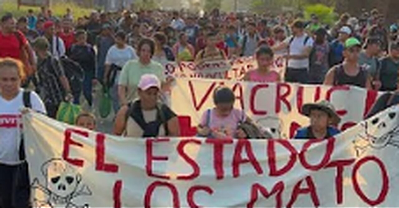 Migrants march through Mexico demanding justice over detention centre deaths - BBC News