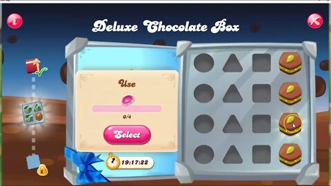 What in the world are those three connected pink dots in the Candy Crush deluxe chocolate box...