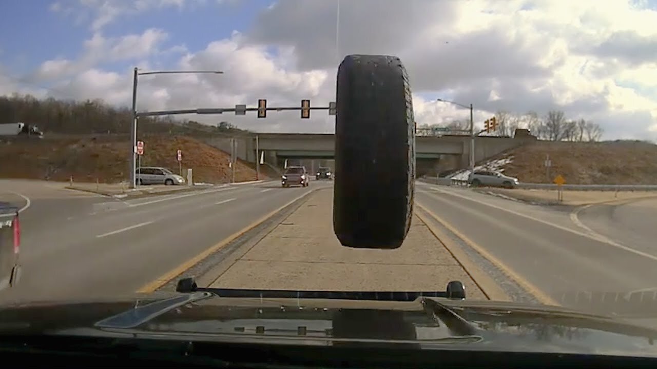 Flying Tire Smashes Police Cruiser Windshield