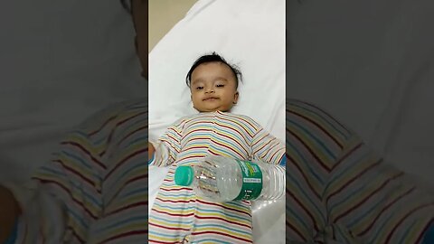 4 months old baby trying to open water bottle #short #shorts #shortsvideo