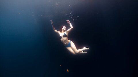 Camila dances underwater