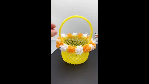 A small flower basket made of fruit nets mineral water bottles, simple and beautiful
