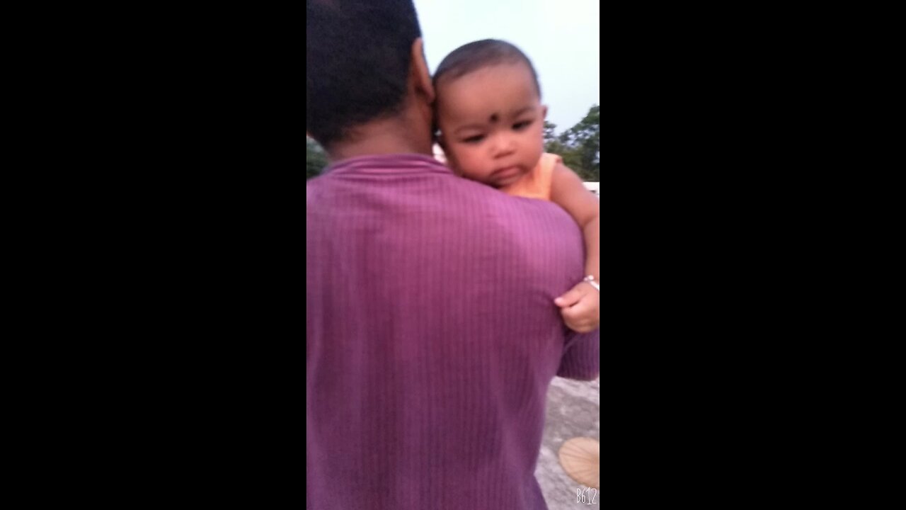 small baby dancing with father