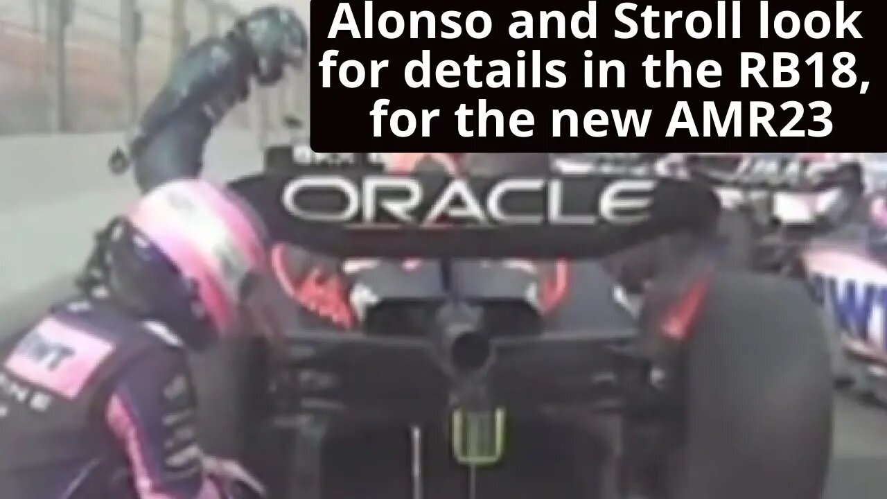 Fernando and Lance sneaking a glance at the Red Bull RB18