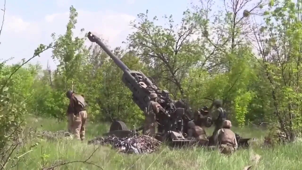 Ukrainian M777 155mm howitzer battery in combat action fires at Russian targets in the East