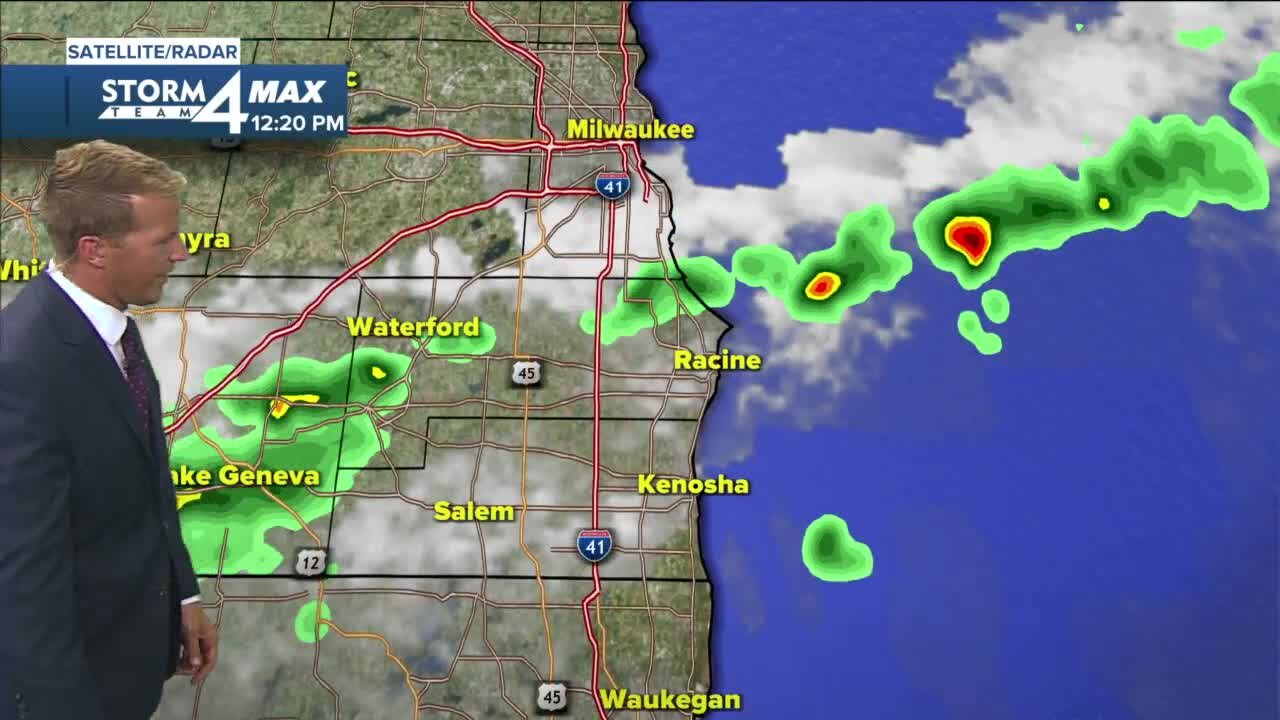 Mostly sunny and warm Wednesday with slight chance for showers
