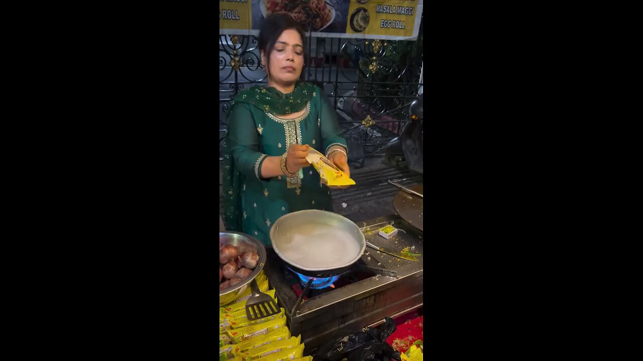 ledy selling Maggie Street food