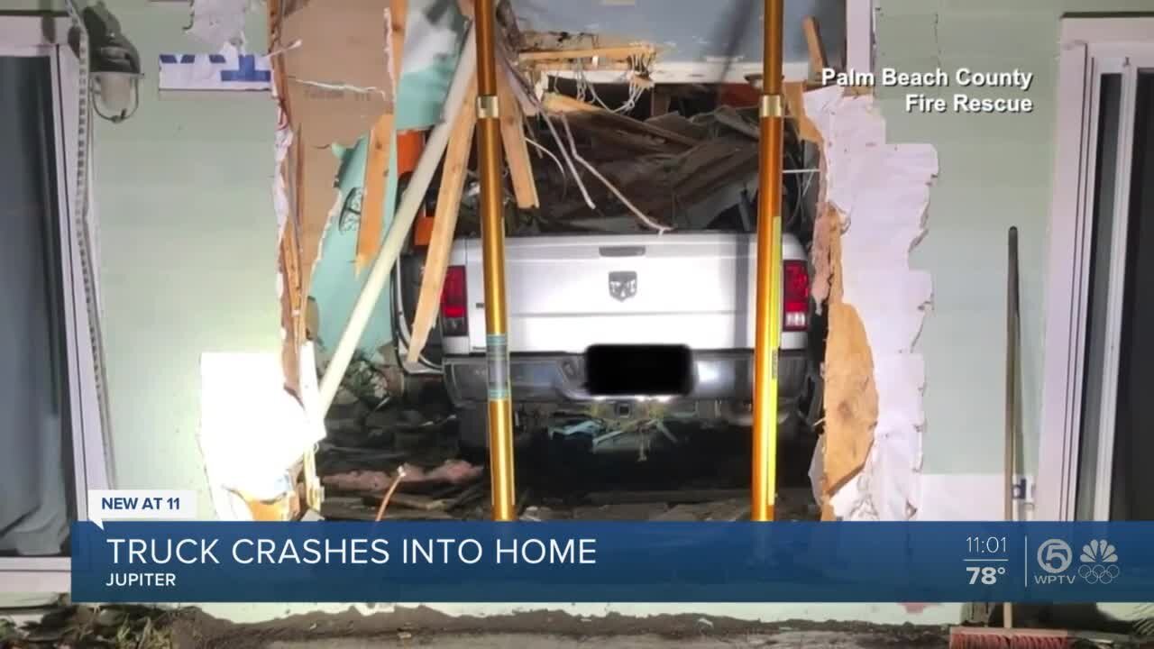 Truck crashes into home in Jupiter