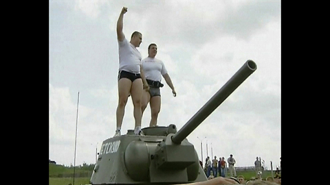 2 Men Pull A Tank